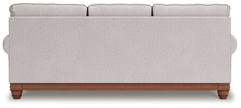 Ashley Furniture Clearbrooke Living Room Set featuring a sofa and armchair with plush cushions and neutral upholstery.