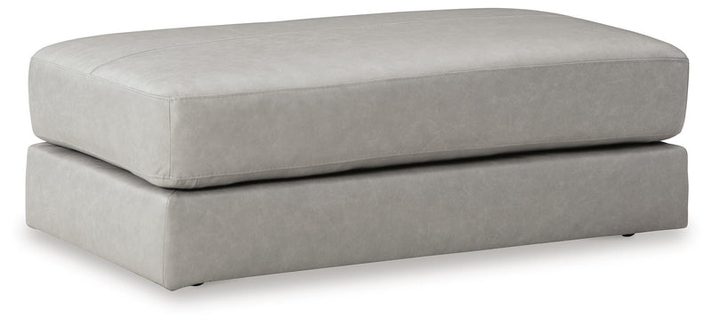 Ashley Furniture Amiata living room set upholstery package with sofa and armchair in neutral fabric, angled view.