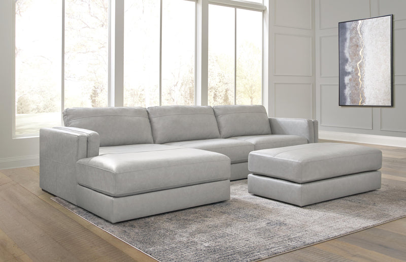 Ashley Furniture Amiata upholstery package for living room set with plush cushions and modern design, shown in neutral fabric.
