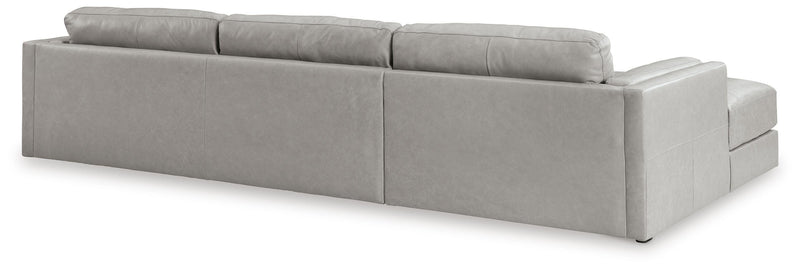 Ashley Furniture Amiata sectional with chaise, showing plush fabric upholstery and modern design from the back view.