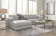 Ashley Furniture Amiata sectional with chaise, featuring plush cushions and a modern design in a neutral fabric.