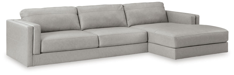 Ashley Furniture Amiata sectional with chaise, showing a modern upholstered sofa with plush cushions and a chaise lounge.