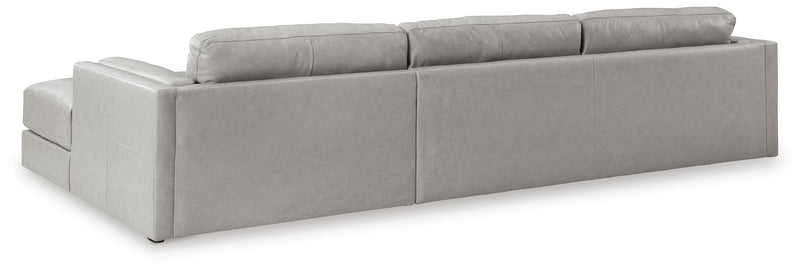 Ashley Furniture Amiata upholstery living room set with plush fabric, including sofa and loveseat, shown from the back view.