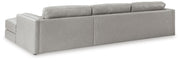 Ashley Furniture Amiata sectional with chaise, showing the back view of the modern, upholstered sectional sofa in a living room setting.