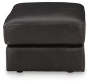 Ashley Furniture Amiata upholstery package for living room set, featuring sofa and side chair with neutral fabric.