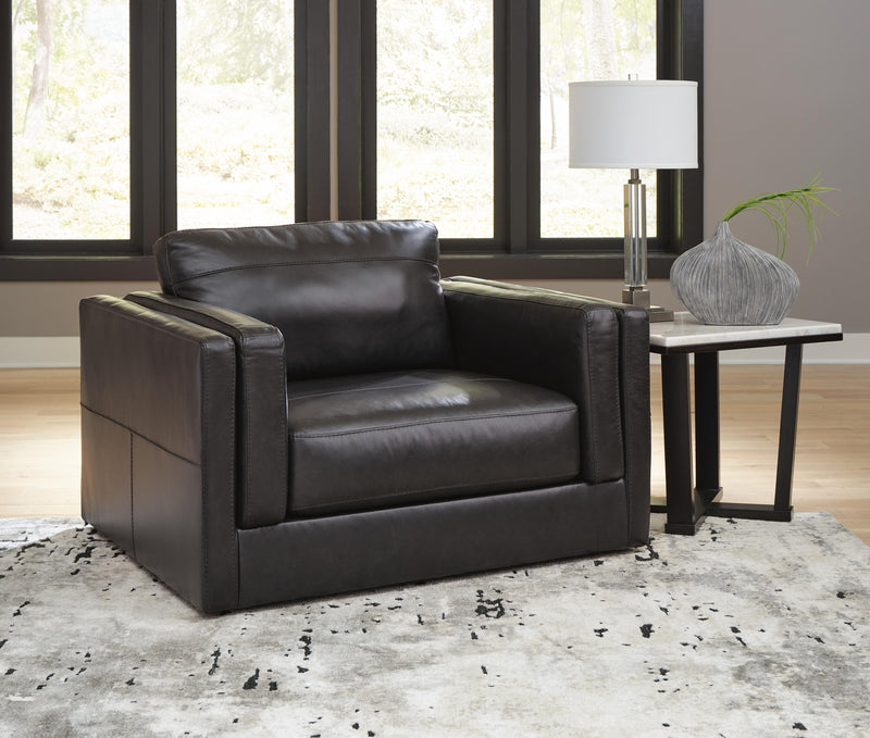 Ashley Furniture Amiata upholstery package for living room set, featuring plush fabric sofa with cushions and matching armchair.