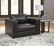 Ashley Furniture Amiata oversized chair with plush fabric and wide armrests, perfect for a cozy living room seating.