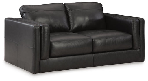 Ashley Furniture Amiata Loveseat with plush fabric, angled view showing comfortable cushions and stylish design.