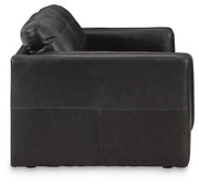Ashley Furniture Amiata upholstery package featuring a stylish living room set with sofa and side table in a cozy design.