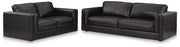 Ashley Furniture Amiata upholstery package featuring a stylish living room set with sofa, loveseat, and armchair in a modern fabric.
