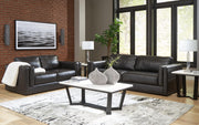 Ashley Furniture Amiata upholstery package featuring a stylish living room set with sofa, loveseat, and armchair in neutral fabric.