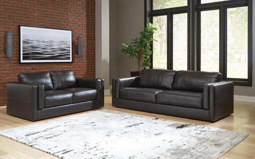 Ashley Furniture Amiata upholstery package for living room set, includes sofa and armchair with plush fabric and modern design.
