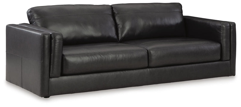 Ashley Furniture Amiata upholstery package featuring a stylish living room set with sofa and armchair, shown from an angled view.