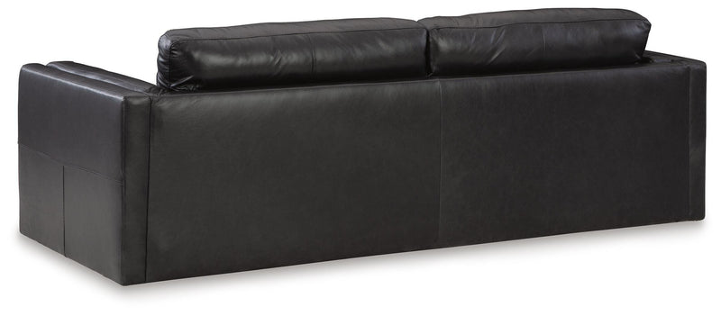 Ashley Furniture Amiata upholstery package for living room set, showing fabric-covered sofa back and cushions in neutral tones.