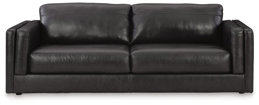 Ashley Furniture Amiata sofa in beige fabric with plush cushions and wide armrests, shown from a front head-on view.