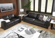 Ashley Furniture Amiata living room set upholstery package with sofa and armchair in neutral fabric, modern and comfortable design.