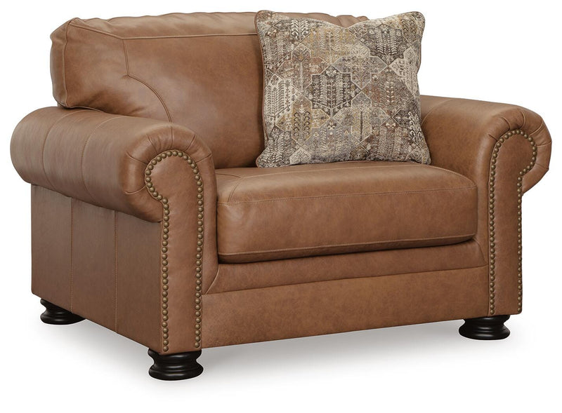 Ashley Furniture Carianna oversized chair with plush fabric and wide armrests, shown from an angled side view.