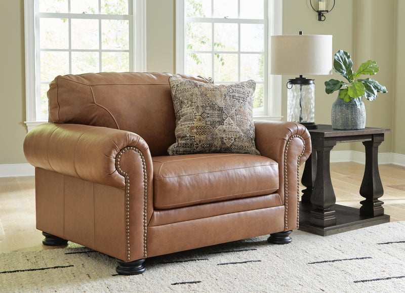Ashley Furniture Carianna oversized chair with plush fabric and wide armrests, ideal for comfortable lounging in living rooms.