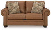 Ashley Furniture Carianna loveseat with plush fabric and cushioned armrests, shown from a head-on view.