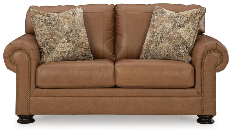 Ashley Furniture Carianna loveseat with plush fabric and cushioned armrests, shown from a head-on view.