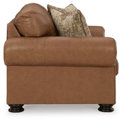 Ashley Furniture Carianna loveseat with plush fabric and cushioned armrests, shown from a side angle.