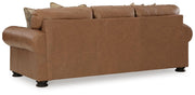 Ashley Furniture Carianna sofa with plush fabric and supportive back cushions, shown from the back in a modern living room setting.