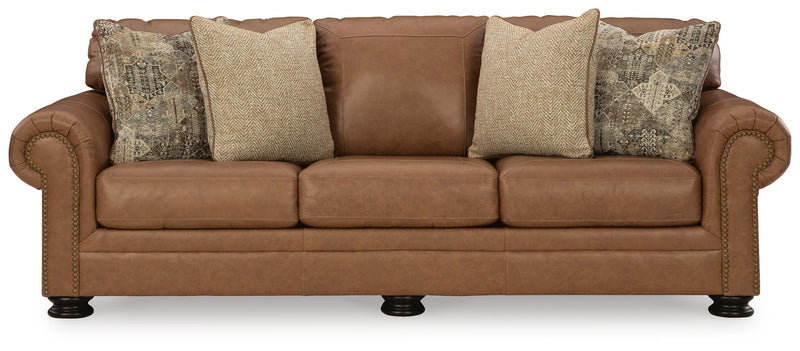 Ashley Furniture Carianna sofa with plush cushions and neutral fabric, shown from a head-on angle.