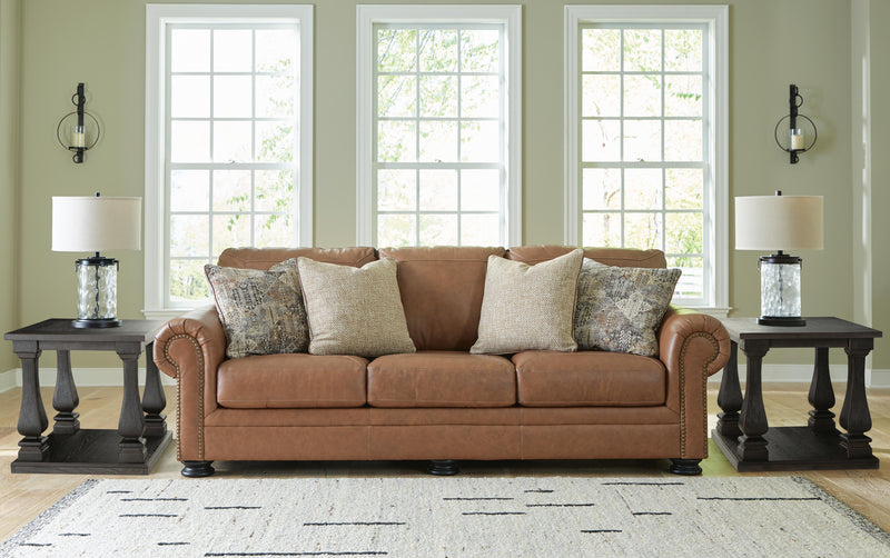 Ashley Furniture Carianna Sofa in a stylish design with plush cushions and fabric upholstery, shown in a living room setting.