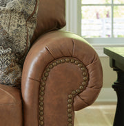 Ashley Furniture Carianna Sofa Sleeper with plush fabric and fold-out bed, shown in a detailed close-up image.