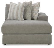Ashley Furniture Avaliyah sectional with chaise, showing a contemporary fabric sofa with plush cushions and a spacious chaise lounge.