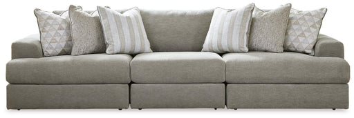 Ashley Furniture Avaliyah sectional sofa with plush cushions and modern design in a neutral fabric, shown in a stylish living room setting.