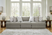 Ashley Furniture Avaliyah sectional sofa with plush cushions and modern design, shown in a spacious living room setting.