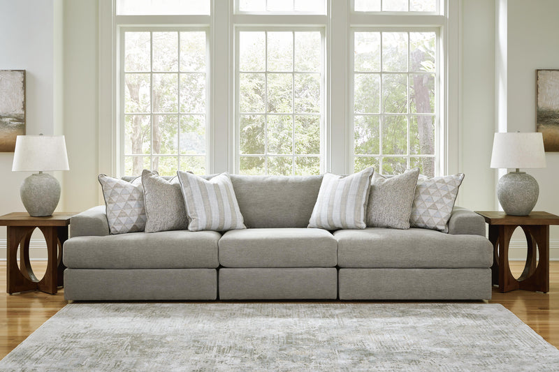 Ashley Furniture Avaliyah sectional sofa with plush cushions and modern design, shown in a spacious living room setting.