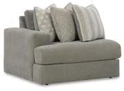 Ashley Furniture Avaliyah sectional with chaise, showcasing plush fabric upholstery and stylish design from a side angle.