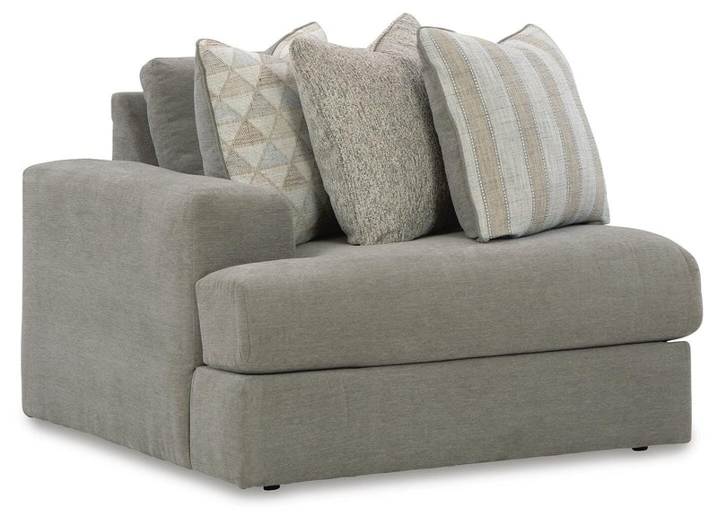 Ashley Furniture Avaliyah sectional with chaise, showcasing plush fabric upholstery and stylish design from a side angle.