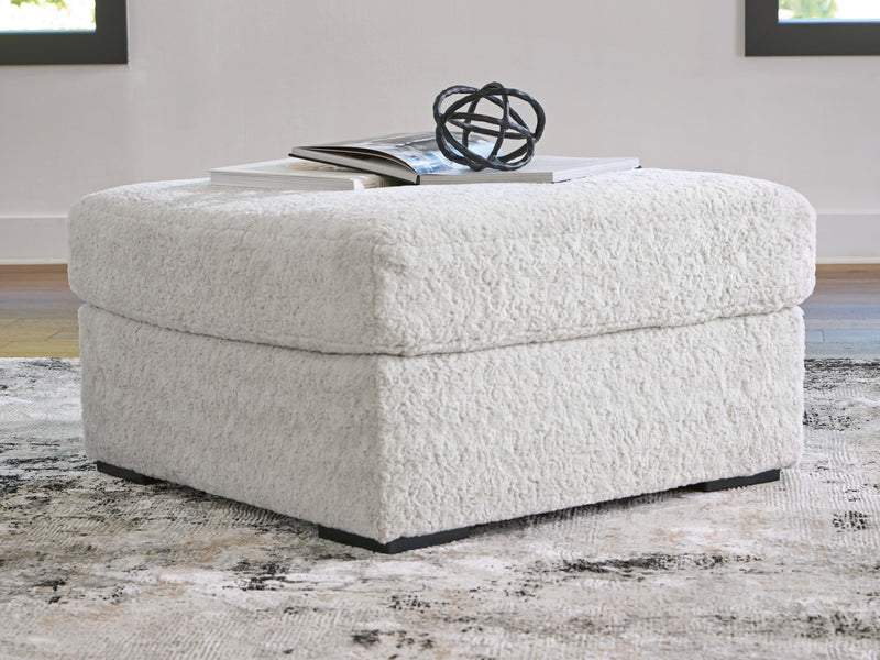 Ashley Furniture Cuddle Plush Sectional in soft, plush fabric with wide armrests and deep seating for comfortable lounging.