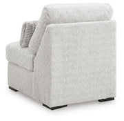 Ashley Furniture Cuddle Plush sectional with chaise, featuring soft upholstery and a comfortable, modern design.