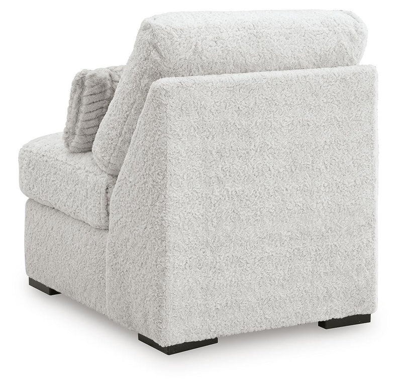 Ashley Furniture Cuddle Plush sectional with chaise, featuring soft upholstery and a comfortable, modern design.
