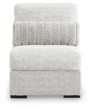 Ashley Furniture cuddle plush sectional with chaise, featuring soft upholstery and a cozy seating arrangement.
