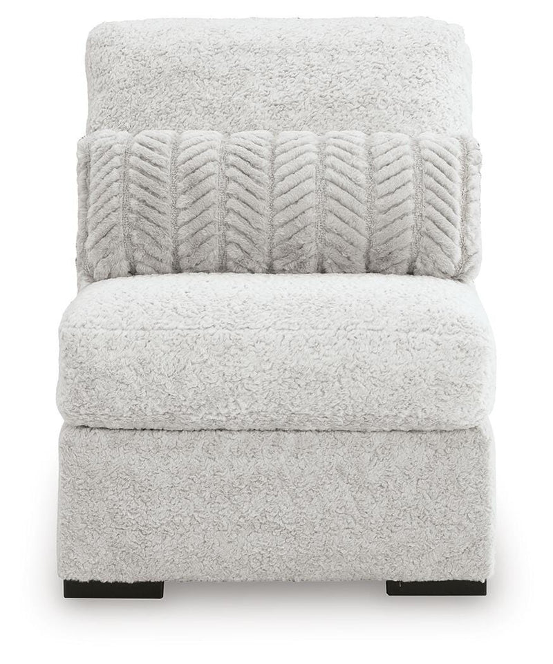 Ashley Furniture cuddle plush sectional with chaise, featuring soft upholstery and a cozy seating arrangement.