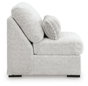 Ashley Furniture Cuddle Plush sectional with chaise showing soft fabric, plush cushions, and modern design in a cozy living room setting.