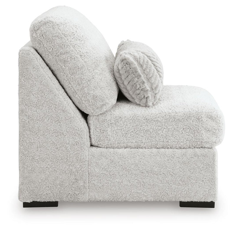 Ashley Furniture Cuddle Plush sectional with chaise showing soft fabric, plush cushions, and modern design in a cozy living room setting.