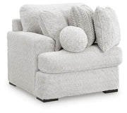 Ashley Furniture Cuddle Plush Sectional with Chaise shown from an angled view, featuring plush upholstery and a spacious chaise lounge.