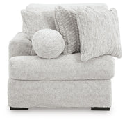 Ashley Furniture Cuddle Plush sectional with chaise, featuring soft fabric and plush cushions for a cozy seating area.