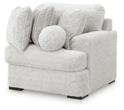 Ashley Furniture Cuddle Plush sectional with chaise, featuring soft upholstery and modern design, viewed from an angled side.