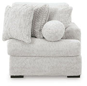 Ashley Furniture Cuddle Plush Sectional with Chaise, featuring soft plush upholstery and a spacious chaise lounge.