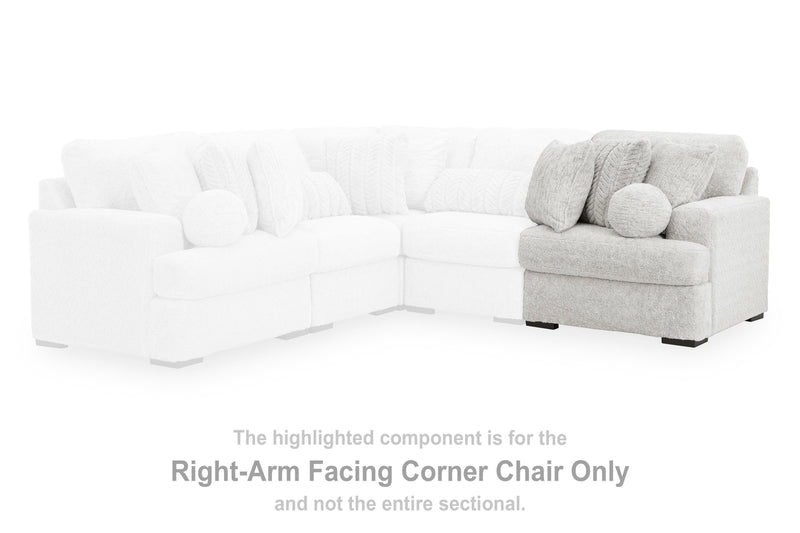 Ashley Furniture Cuddle Plush Sectional with Chaise, featuring soft upholstery and comfortable seating in a modern living room setting.
