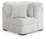 Ashley Furniture Cuddle Plush sectional with chaise, featuring soft fabric upholstery and plush cushions in a cozy living room setting.
