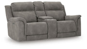 Ashley Furniture Next-Gen DuraPella power reclining loveseat with console, shown from an angled view with closed recliners.