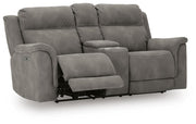 Ashley Furniture Next-Gen DuraPella power reclining loveseat with console, shown in an open, angled view highlighting its plush upholstery.